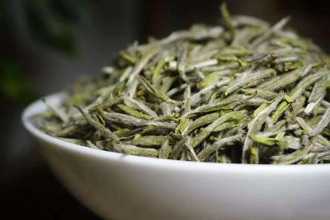 Dried tea leaves of silver needle white tea (bai hao yin zhen)